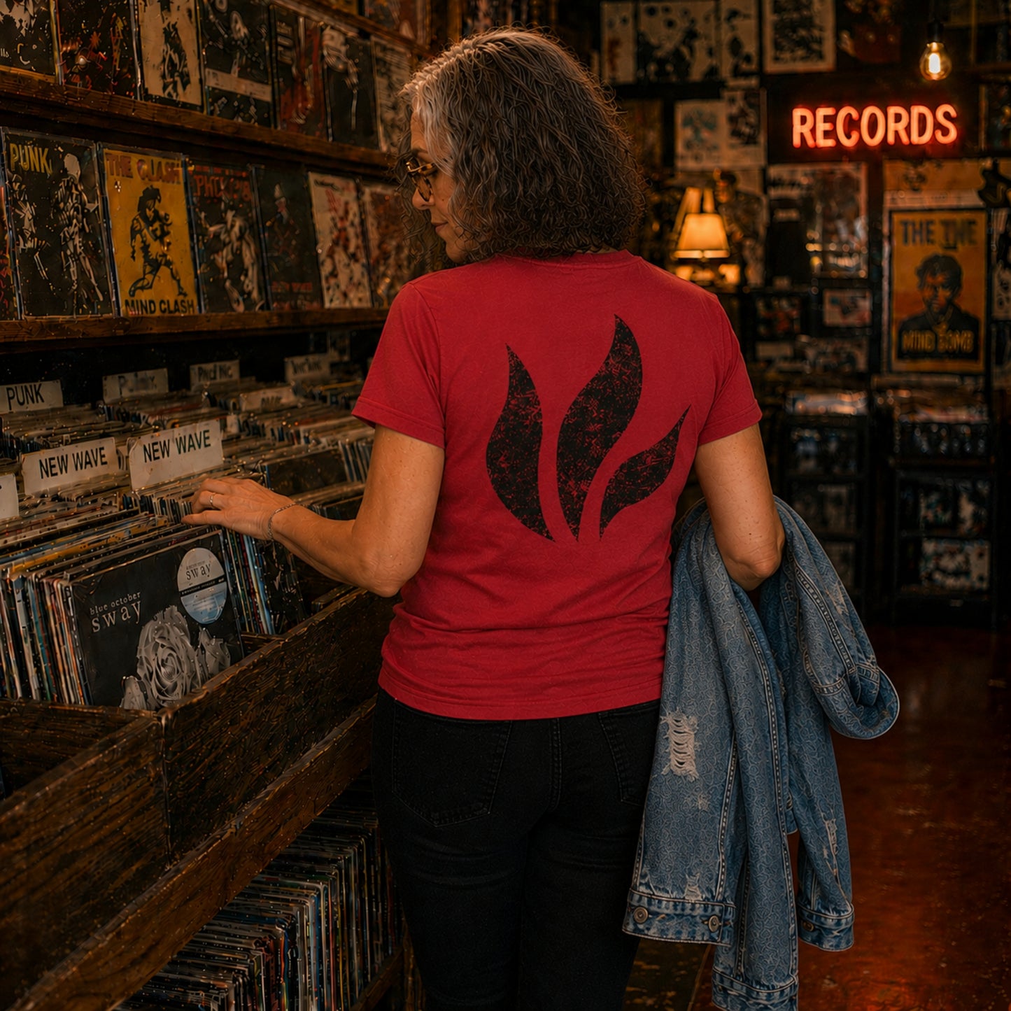 A woman wearing the Blue October Red Foiled Flame T-shirt.