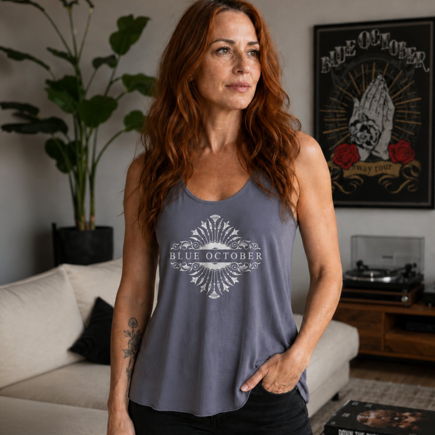 Woman wearing the gray 20th Anniversary Blue October logo tank top