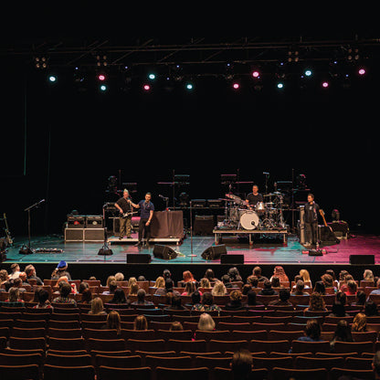 Band performing on stage with audience in a theater setting - Blue October's VIP Meet & Greet