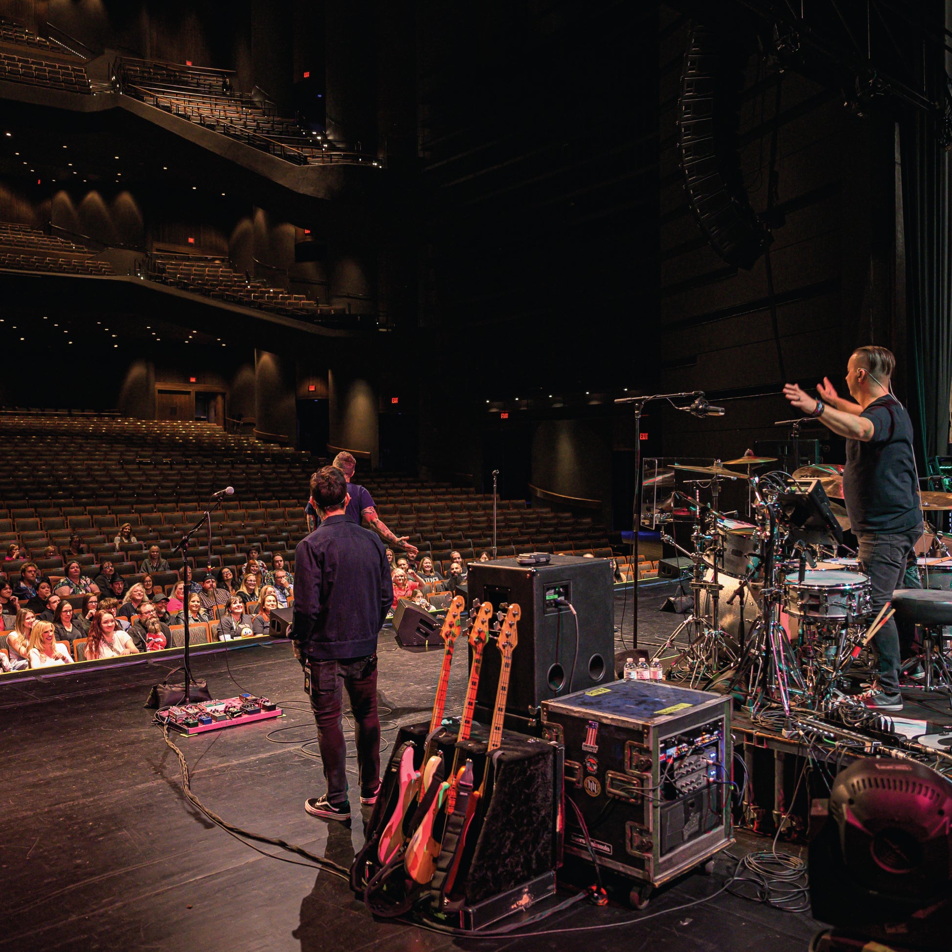 Stage with musicians and equipment, audience in the background - Blue October's VIP Meet & Greet